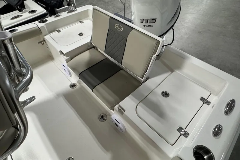 Slide: The Image of 2026 Key West 188 Bay Reef boat interior with Yamaha 115 engine, featuring seating and storage. - 14