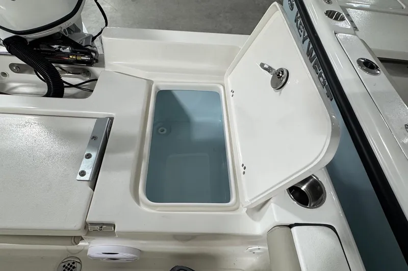 Slide: The Image of Open storage compartment on 2026 Key West 188 Bay Reef boat, showcasing interior design. - 15