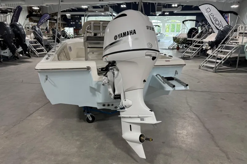 Slide: The Image of 2026 Key West 188 Bay Reef boat with Yamaha outboard motor in showroom. - 4