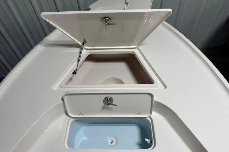 Slide: The Image of 2026 Key West 188 Bay Reef boat storage compartments, open and ready for use. - 6