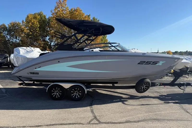 Slide: The Image of 2026 Yamaha Boats 255XD on trailer, sleek design, parked outdoors. - 3