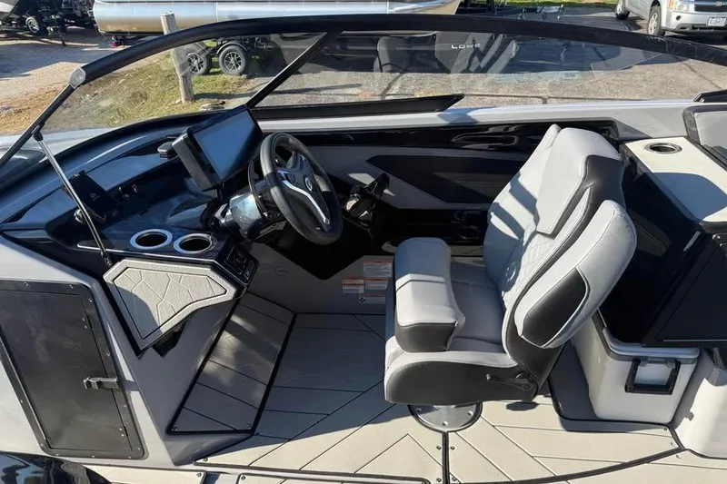 Slide: The Image of 2026 Yamaha Boats 255XD cockpit with modern steering, controls, and comfortable seating. - 7