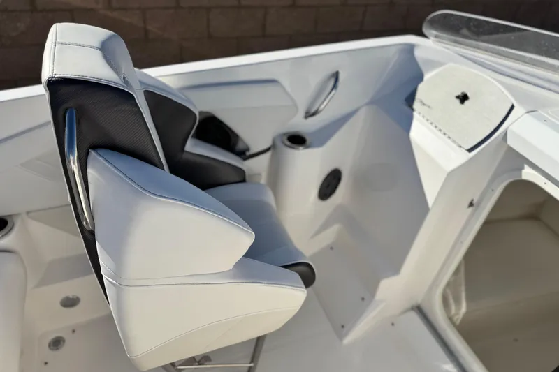 Slide: The Image of 2019 Baja 27 Outlaw boat interior with white and black seating. - 19