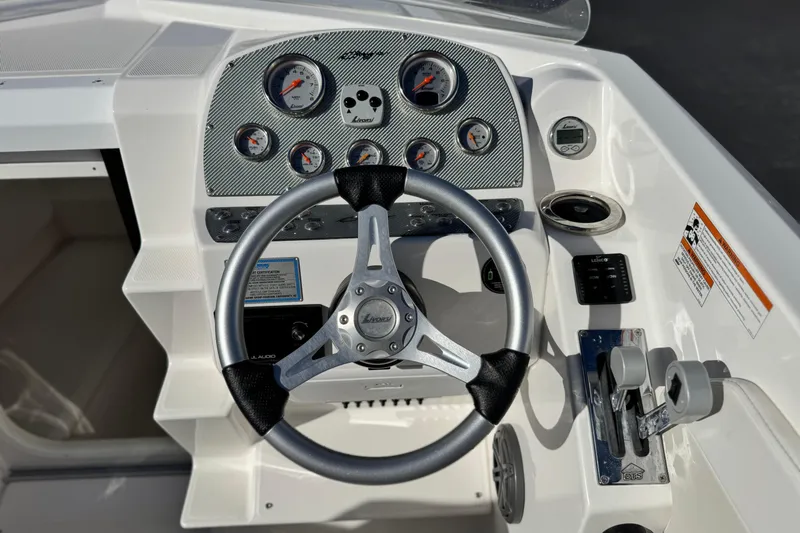 Slide: The Image of 2019 Baja 27 Outlaw dashboard with steering wheel and control panel. - 22
