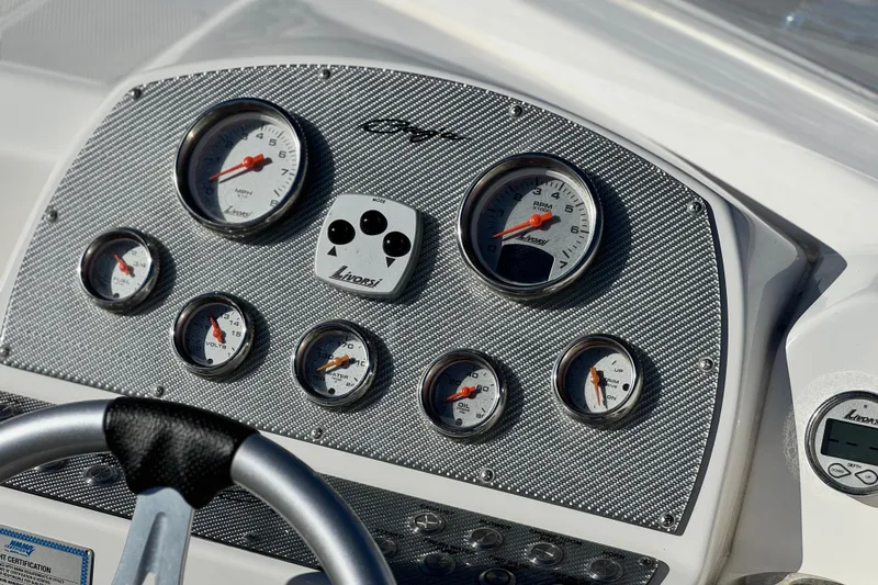 Slide: The Image of Dashboard of 2019 Baja 27 Outlaw boat with Livorsi gauges and steering wheel. - 23