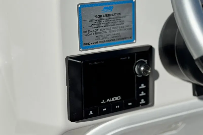 Slide: The Image of Control panel of 2019 Baja 27 Outlaw boat with JL Audio system. - 24