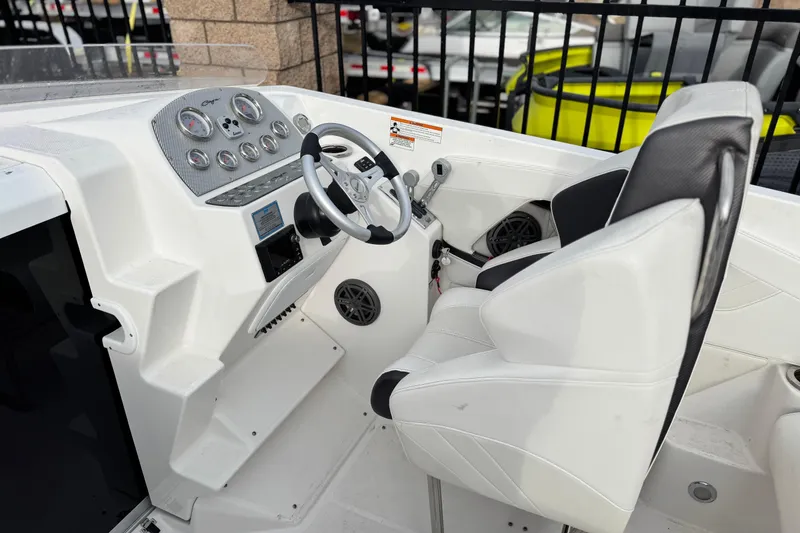 Slide: The Image of 2019 Baja 27 Outlaw boat rear view with dual propellers and trailer. - 5