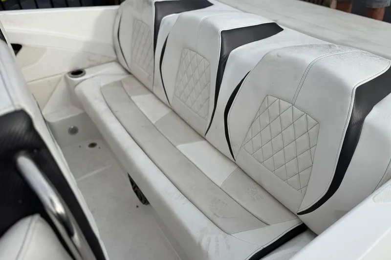 Slide: The Image of 2019 Baja 27 Outlaw speedboat with red and white design on a trailer. - 6