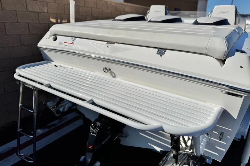 Slide: The Image of 2019 Baja 27 Outlaw boat with white seating and swim platform. - 9