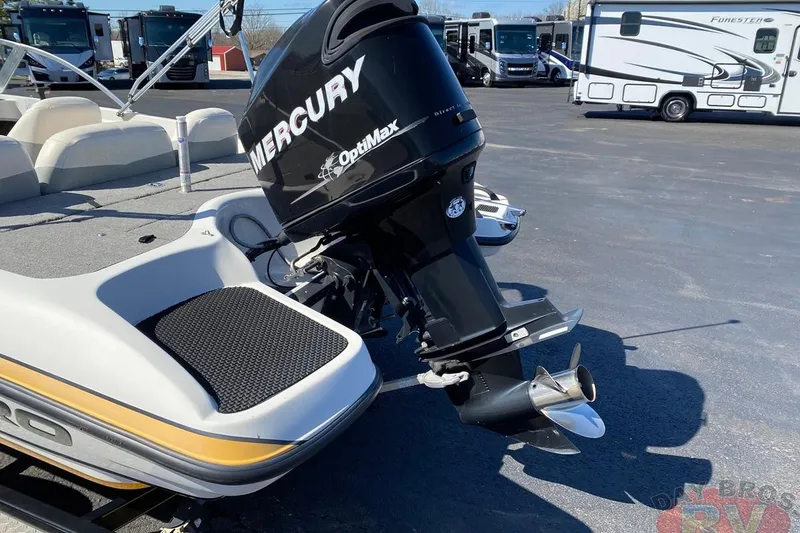 Slide: The Image of 2008 Nitro 189 Sport boat with Mercury OptiMax outboard motor in parking lot. - 12