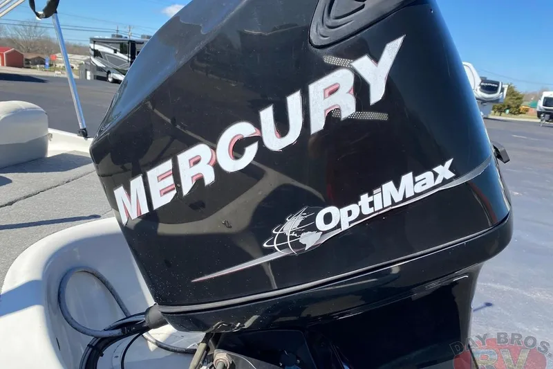 Slide: The Image of Mercury OptiMax engine on a 2008 Nitro 189 Sport boat, parked outdoors. - 13