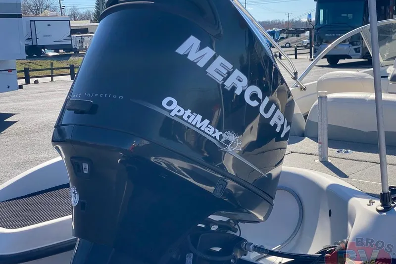 Slide: The Image of 2008 Nitro 189 Sport boat with Mercury OptiMax engine in a sunny outdoor setting. - 15