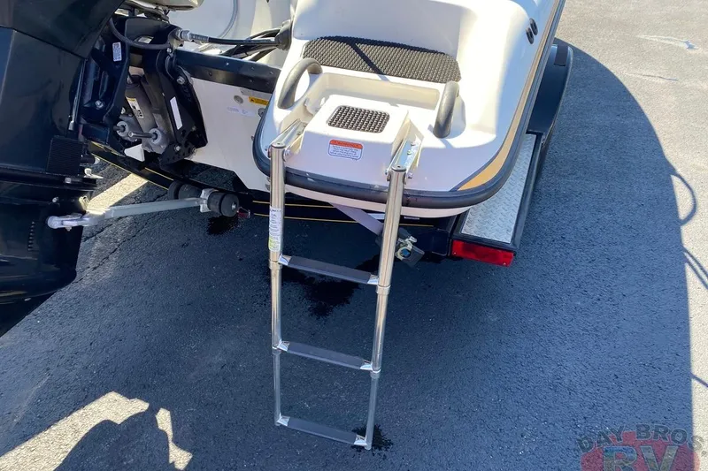 Slide: The Image of 2008 Nitro 189 Sport boat with extended ladder on asphalt surface. - 18