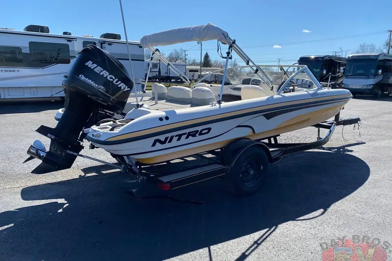 Slide: The Image of 2008 Nitro 189 Sport boat with Mercury engine on trailer in parking lot. - 19