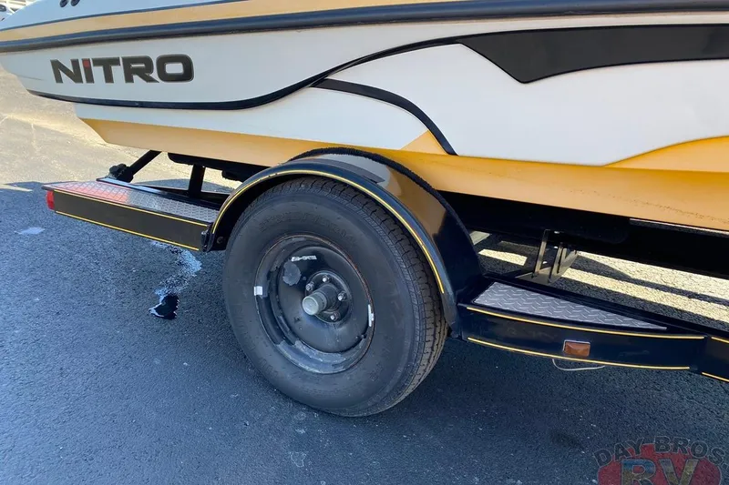 Slide: The Image of 2008 Nitro 189 Sport boat trailer with black wheel and yellow accents. - 23