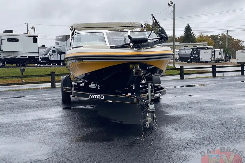 Slide: The Image of 2008 Nitro 189 Sport boat on trailer in parking lot, overcast day. - 3