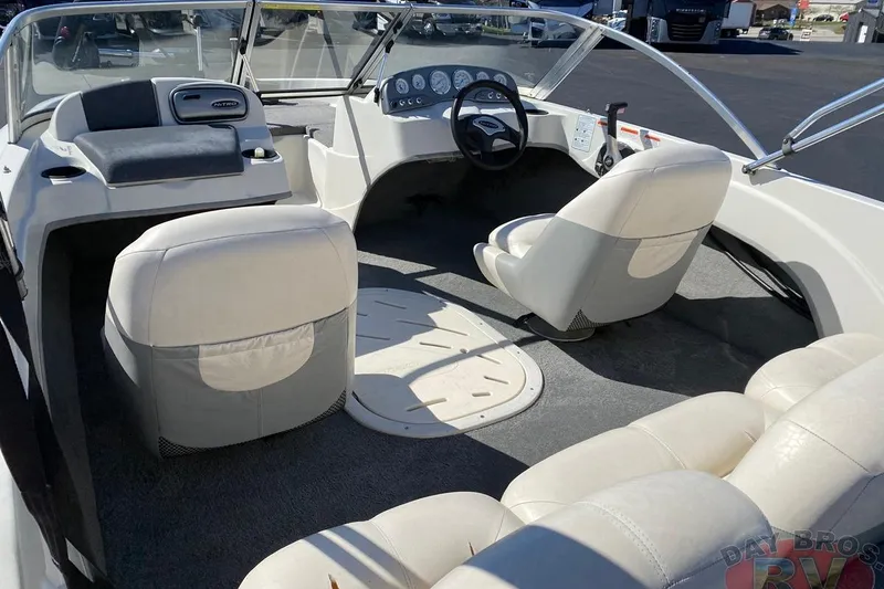 Slide: The Image of Interior of a 2008 Nitro 189 Sport boat with white seating and dashboard. - 38