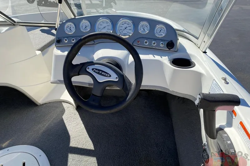 Slide: The Image of 2008 Nitro 189 Sport boat dashboard with steering wheel and instrument panel. - 42