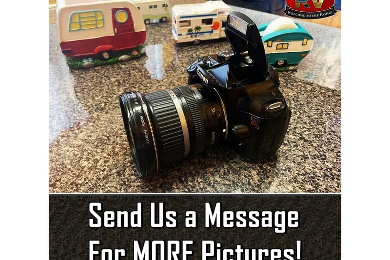 Slide: The Image of Camera on countertop with toy RVs, promoting more picture requests. Nitro 189 Sport, 2008. - 8