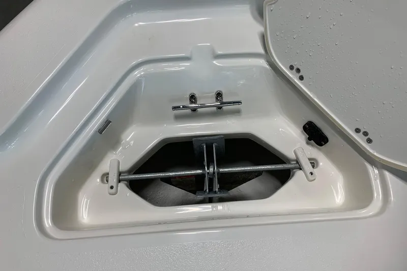 Slide: The Image of Anchor compartment of 2026 Key West 188 Bay Reef boat, open with visible hardware. - 17