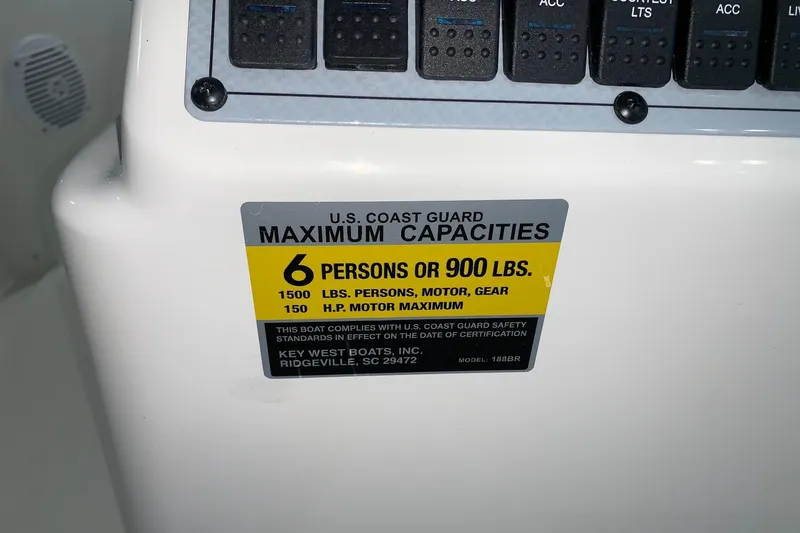 Slide: The Image of Key West 188 Bay Reef 2026 boat capacity label, 6 persons or 900 lbs maximum. - 23