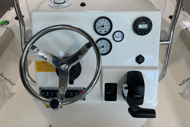 Slide: The Image of Steering console of 2026 Key West 188 Bay Reef boat with gauges and controls. - 7