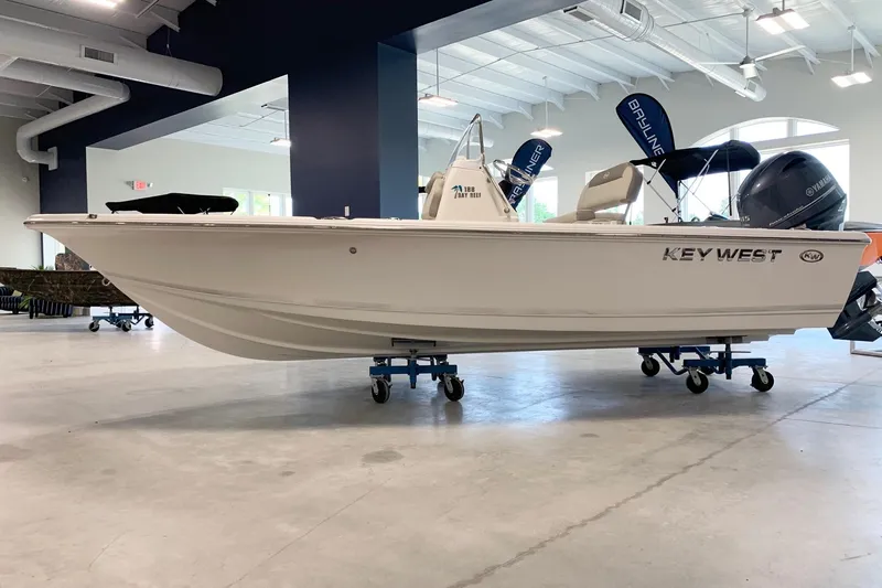 The Image of 2026 Key West 188 Bay Reef boat displayed indoors on wheeled stands. - 1