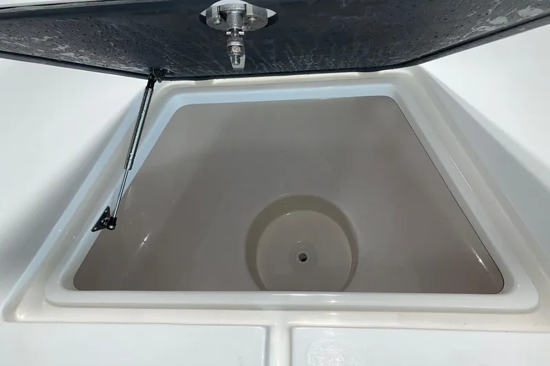 Slide: The Image of Open storage compartment on 2026 Key West 188 Bay Reef boat. - 18