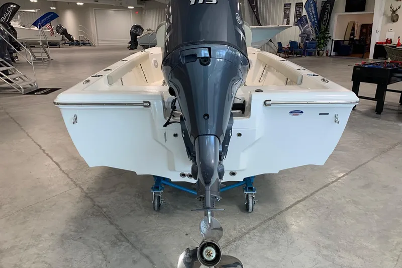 Slide: The Image of 2026 Key West 188 Bay Reef boat with outboard motor in showroom. - 3