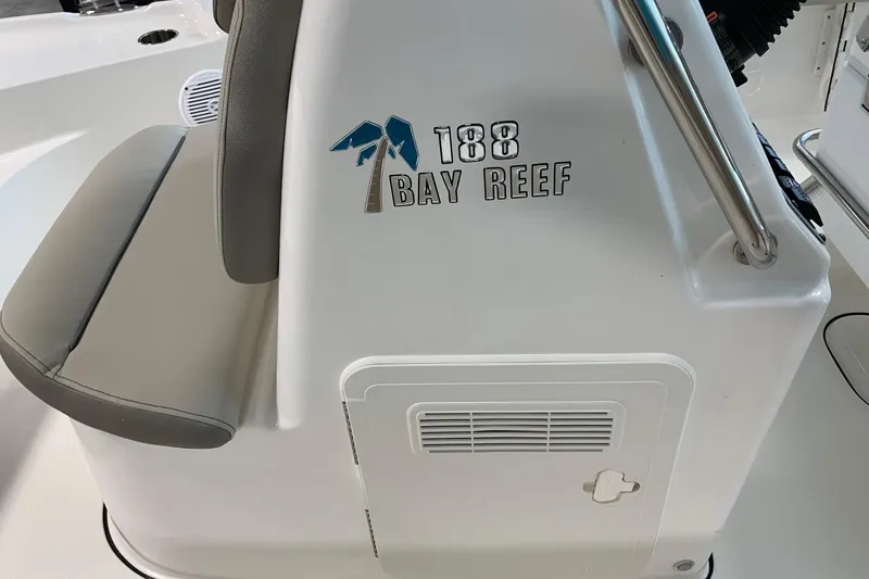 Slide: The Image of 2026 Key West 188 Bay Reef boat interior with logo and seating. - 14
