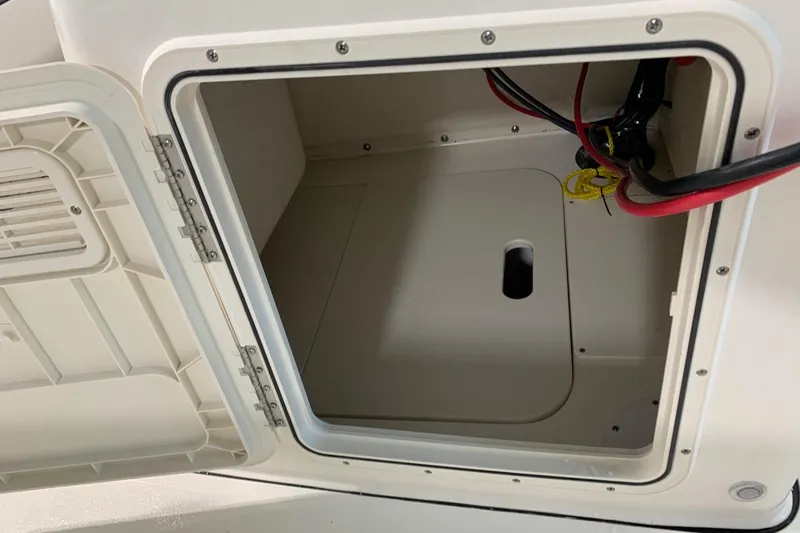 Slide: The Image of Open storage compartment on 2026 Key West 188 Bay Reef boat, showing interior wiring. - 15