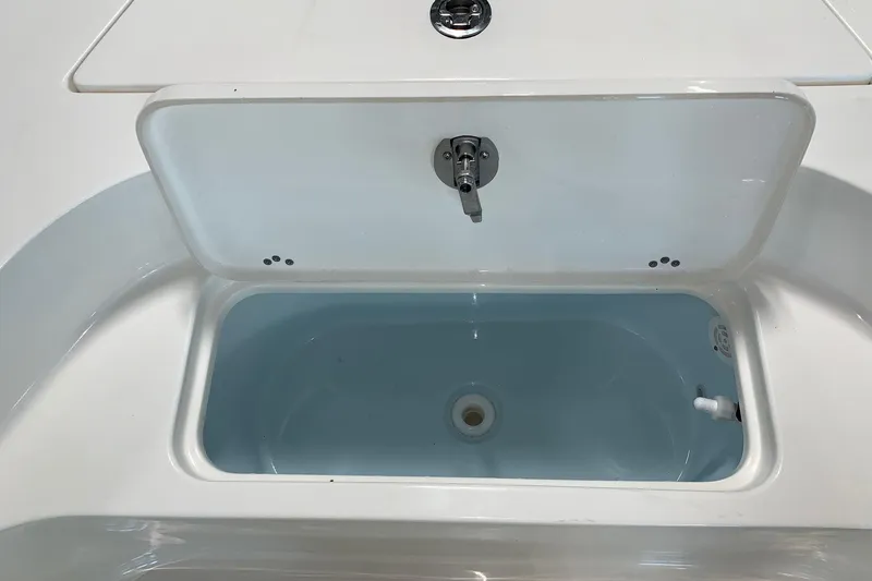 Slide: The Image of Open storage compartment on 2026 Key West 188 Bay Reef boat. - 19