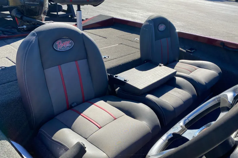 Slide: The Image of 2017 Ranger RT188 boat seats with red accents and steering wheel. - 29