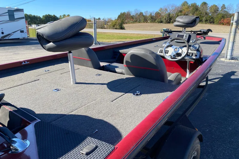 Slide: The Image of 2017 Ranger RT188 fishing boat with red trim and spacious deck. - 33