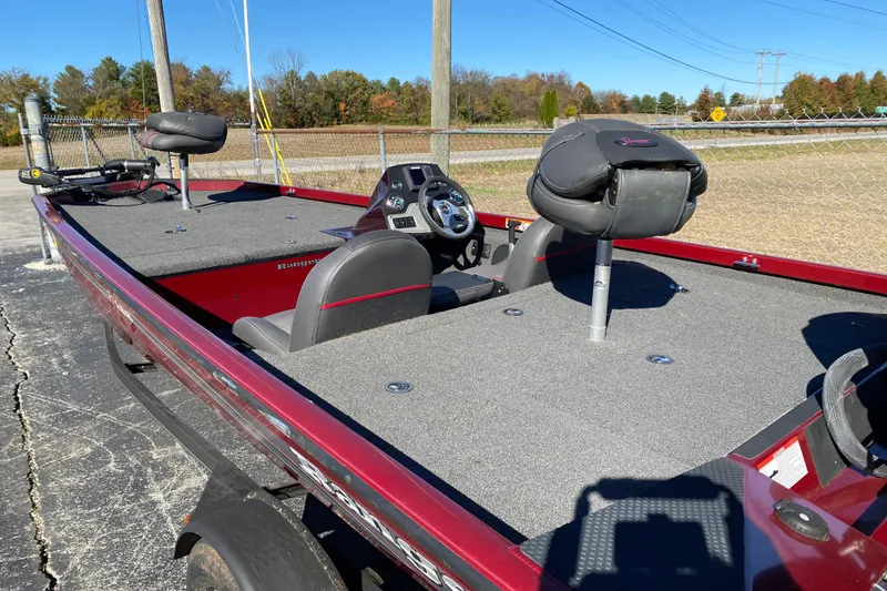 Slide: The Image of 2017 Ranger RT188 fishing boat with red exterior and spacious deck. - 34