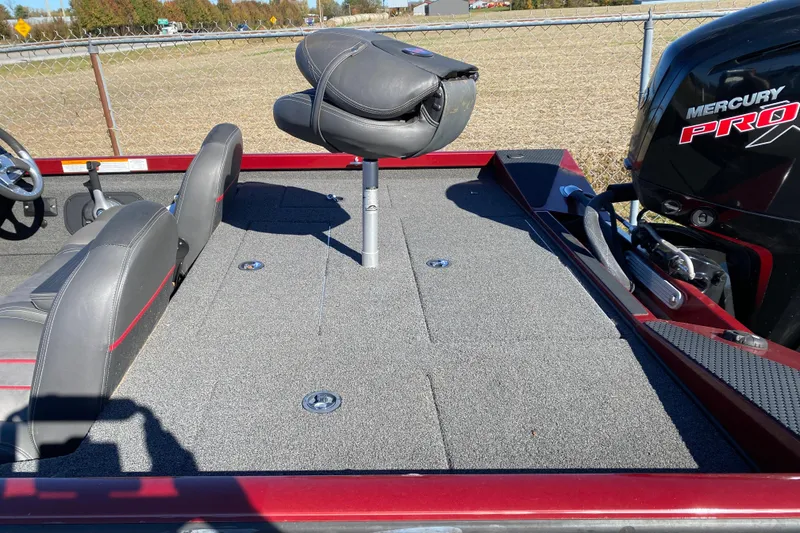 Slide: The Image of 2017 Ranger RT188 boat deck with Mercury Pro motor, featuring gray seating and carpet. - 35