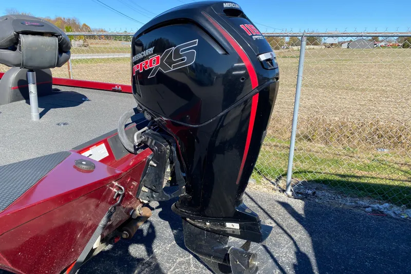 Slide: The Image of 2017 Ranger RT188 boat with Mercury Pro XS outboard motor, parked near a chain-link fence. - 39