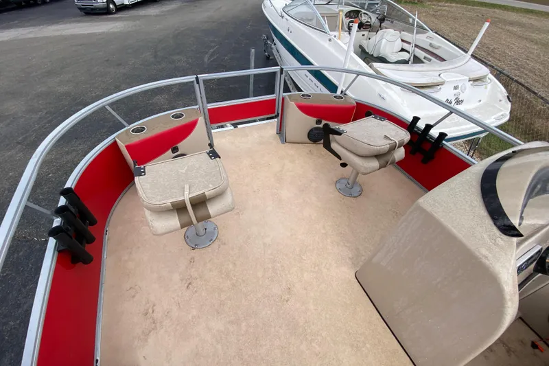 Slide: The Image of 2018 Bentley Pontoons 200 Fish interior with seating and fishing rod holders. - 13