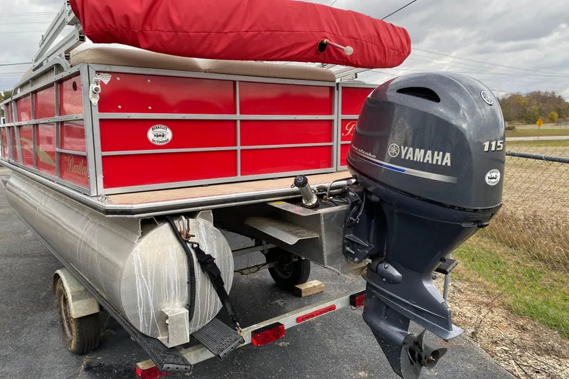 Slide: The Image of 2018 Bentley Pontoons 200 Fish with Yamaha 115 outboard motor, red exterior, on trailer. - 9