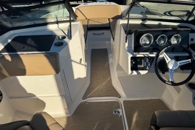 Slide: The Image of 2022 Sea Ray SPX 210 Outboard boat interior with modern dashboard and seating. - 15
