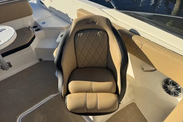 Slide: The Image of 2022 Sea Ray SPX 210 Outboard boat seat with tan upholstery and diamond stitching. - 19