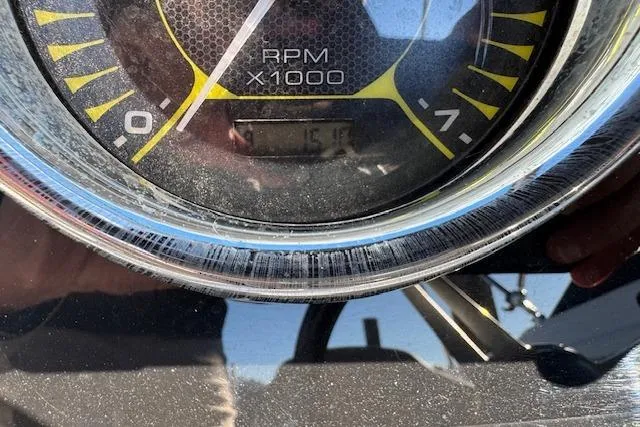 Slide: The Image of Close-up of a 2022 Sea Ray SPX 210 Outboard RPM gauge showing 151 hours. - 21