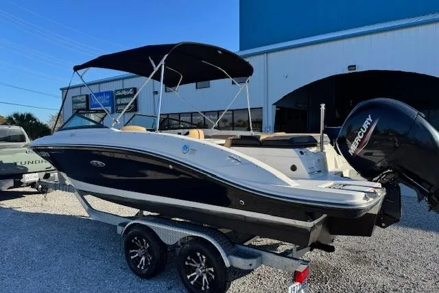 Slide: The Image of 2022 Sea Ray SPX 210 Outboard boat on trailer, featuring a sleek design and Mercury engine. - 4