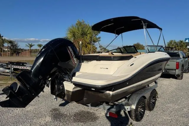 Slide: The Image of 2022 Sea Ray SPX 210 Outboard boat on trailer, featuring a sleek design and powerful engine. - 7