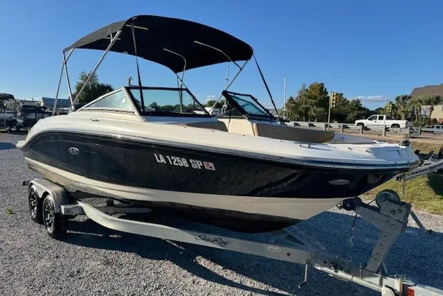 Slide: The Image of 2022 Sea Ray SPX 210 Outboard boat on trailer, black hull, sunny day. - 8