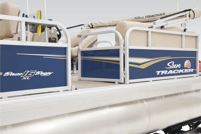 Slide: The Image of 2023 Sun Tracker Bass Buggy 16 XL Select, open storage compartment with beige seating. - 28