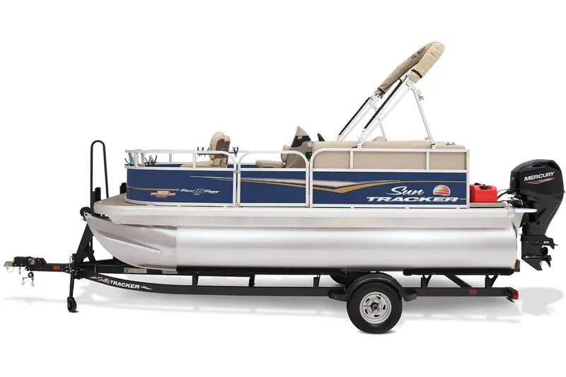 Slide: The Image of 2023 Sun Tracker Bass Buggy 16 XL Select pontoon boat on trailer in outdoor setting. - 4