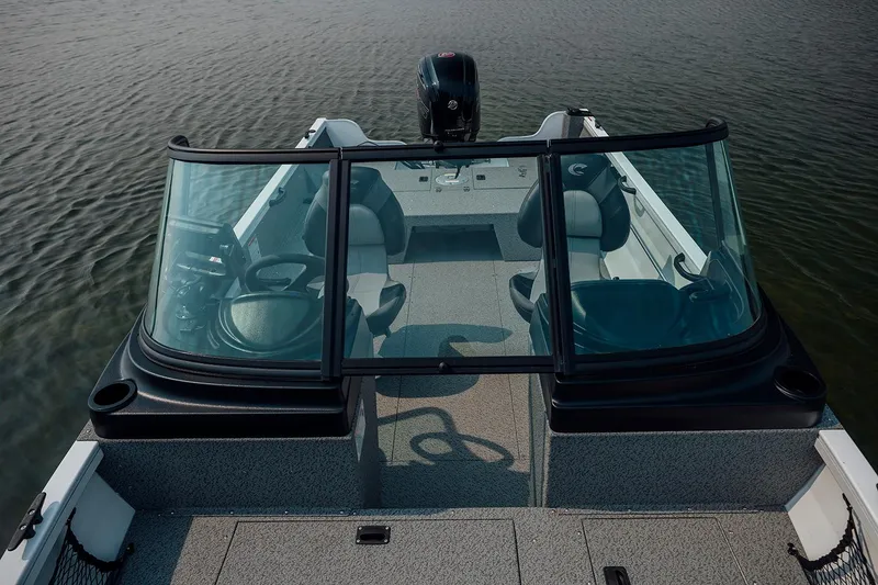 Slide: The Image of Manufacturer Provided Image: 2026 Crestliner 1850 Kodiak WT boat interior with dual seats and windshield on water. - 4