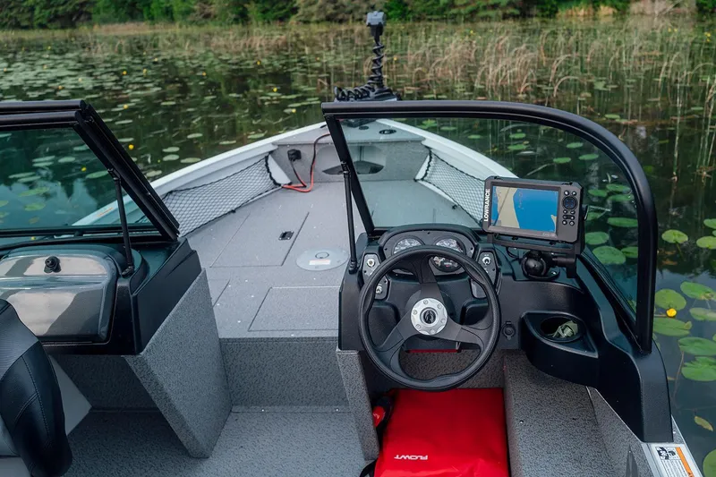 Slide: The Image of Manufacturer Provided Image: 2026 Crestliner 1850 Kodiak WT boat interior with steering wheel and navigation system. - 6