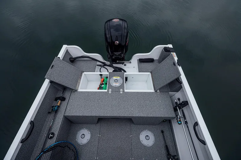 Slide: The Image of Manufacturer Provided Image: 2026 Crestliner 1850 Kodiak WT boat interior with storage compartments and fishing gear. - 8